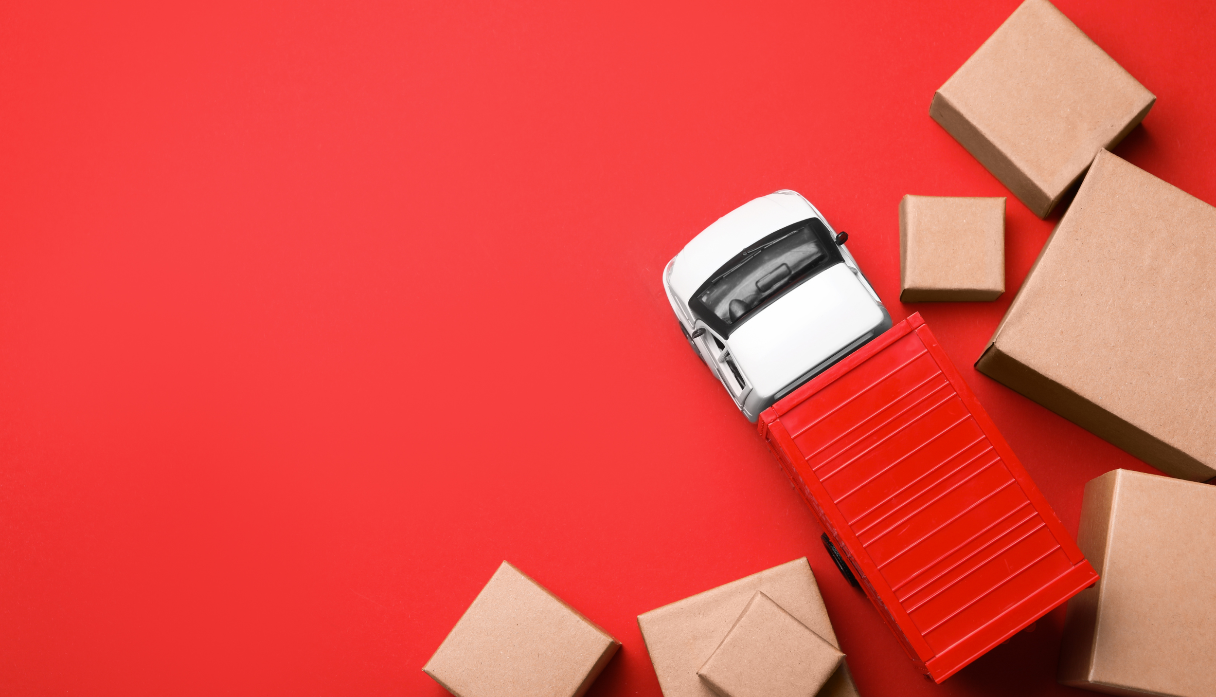 van and boxes on a red background